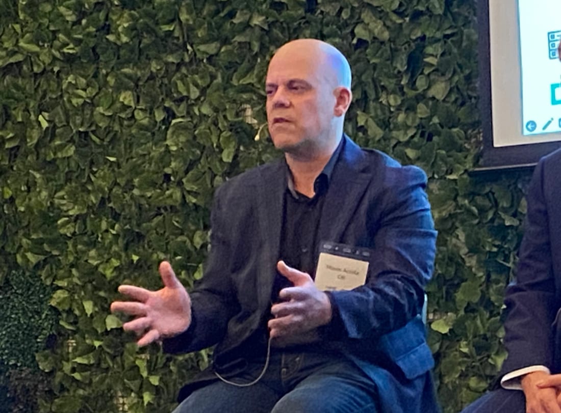Moses Acosta speaking on an enterprise AI infrastructure panel in New York.